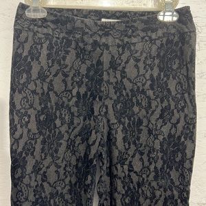 HAROLD’S vintage black velvet and lace straight legged pants.